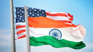 U.S. and India flags against sky