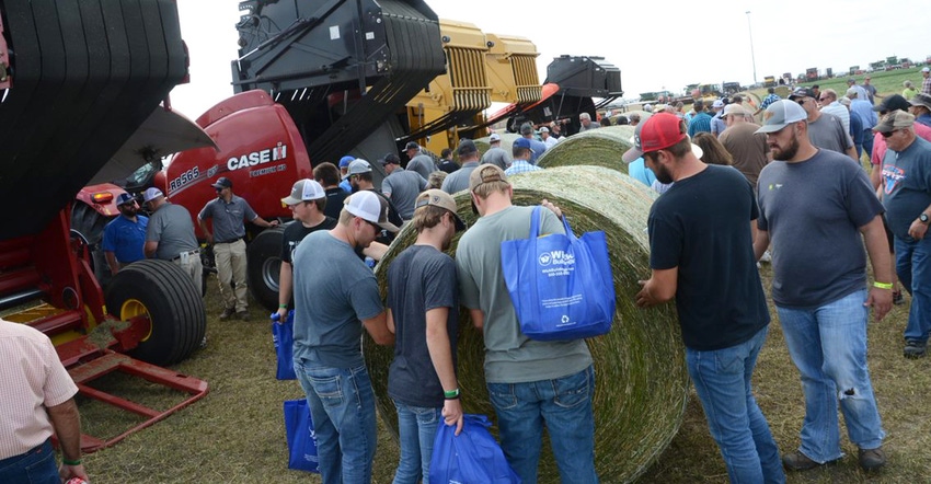 Husker Harvest Attendees look at bales of hay