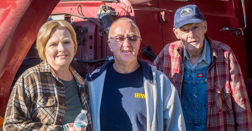 Cynthia Ryan and her dad flank Fritz Robinson, their longtime farm operator