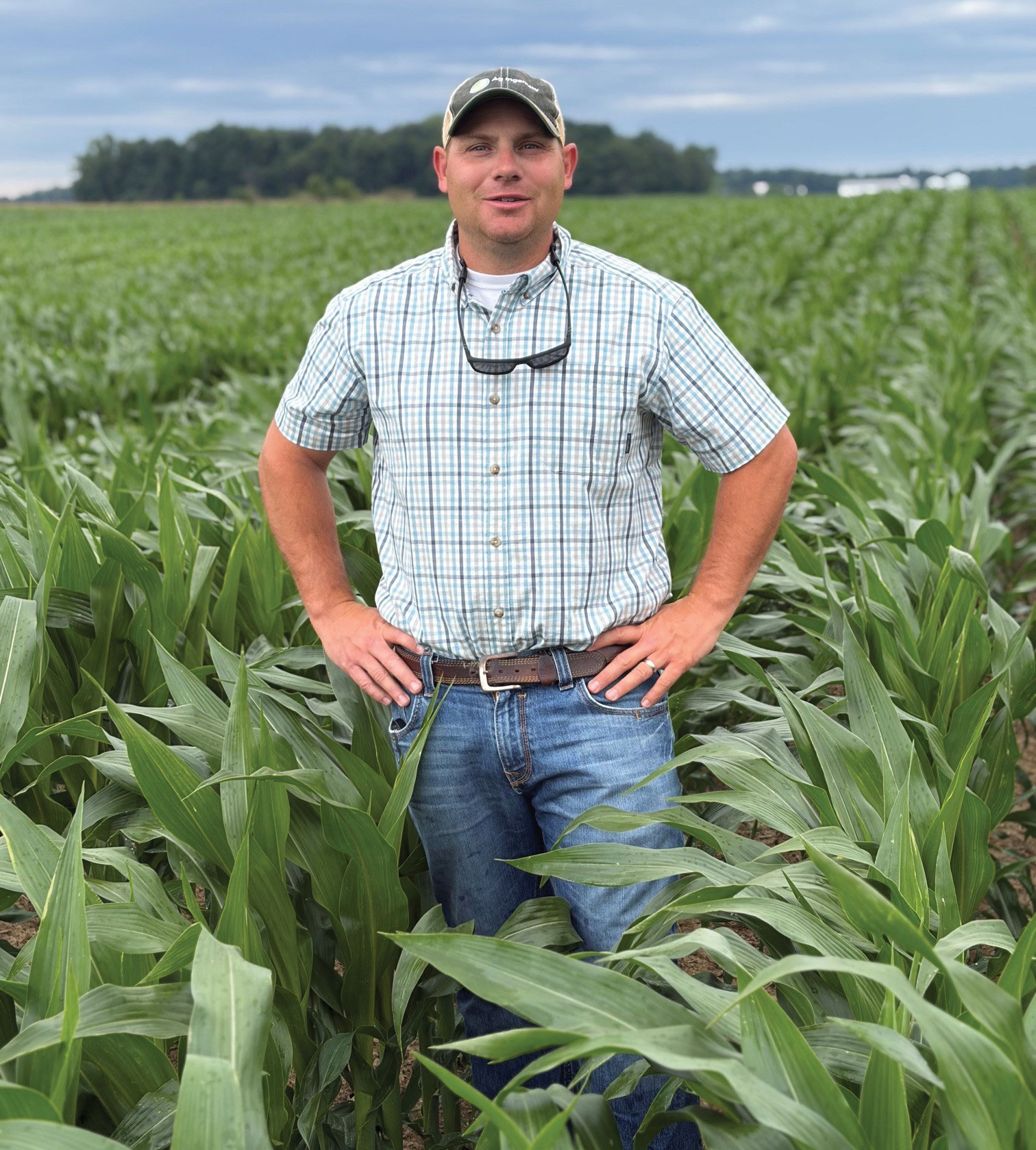 Andrea Greve - Jason Greve, Advanced Agrilytics agronomist, stands in a field of corn