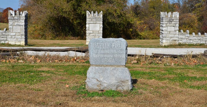 three stone pillars serve as a gateway to the Battle of Lexington historic site three stone pillars serve as a gateway to the Battle of Lexington historic site