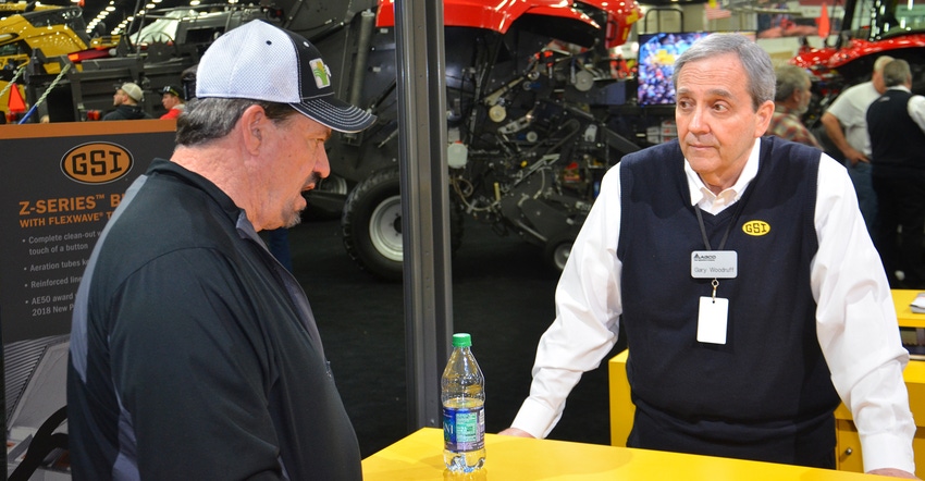 Gary Woodruff talks to a customer at the National Farm Machinery Show