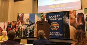 Kansas Secretary of Agriculture Mike Beam at podium welcomes stakeholders to the 2022 Kansas Governor’s Summit on Agricultu