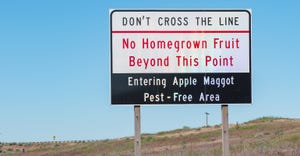 road sign regarding fruit pests