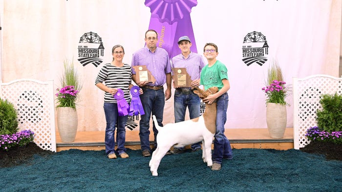 DeEtta, Brent, Cole and Ty Murphy with grand champion market goat at the Missouri State Fair