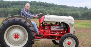Sharon Green of Cadott, Wis. sitting on Ford 8N tractor