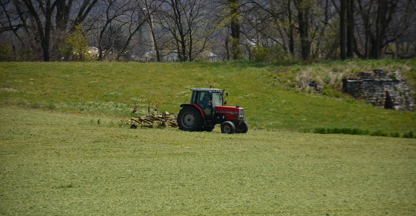 A tractor outside Richland, Pa., rakes a field of winter grain 