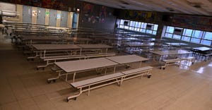 The cafeteria is empty on what would otherwise be a school day at Yung Wing School P.S. 124 in the Manhattan