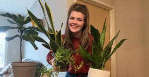 Sarah McNaughton holding house plants