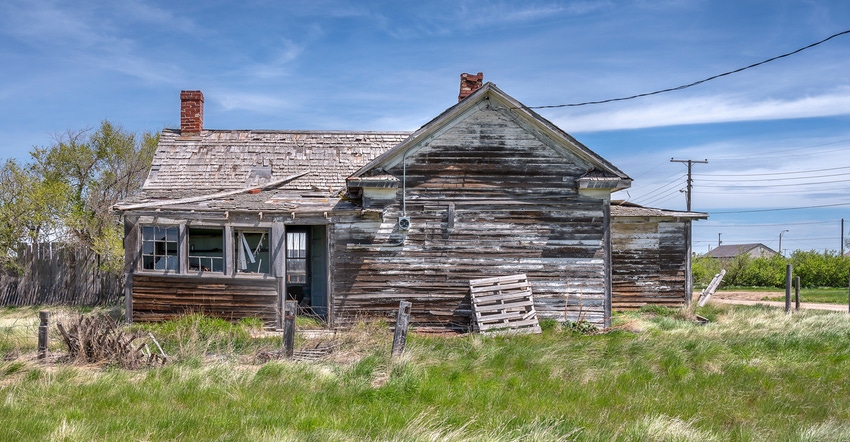 Abandoned old house in field