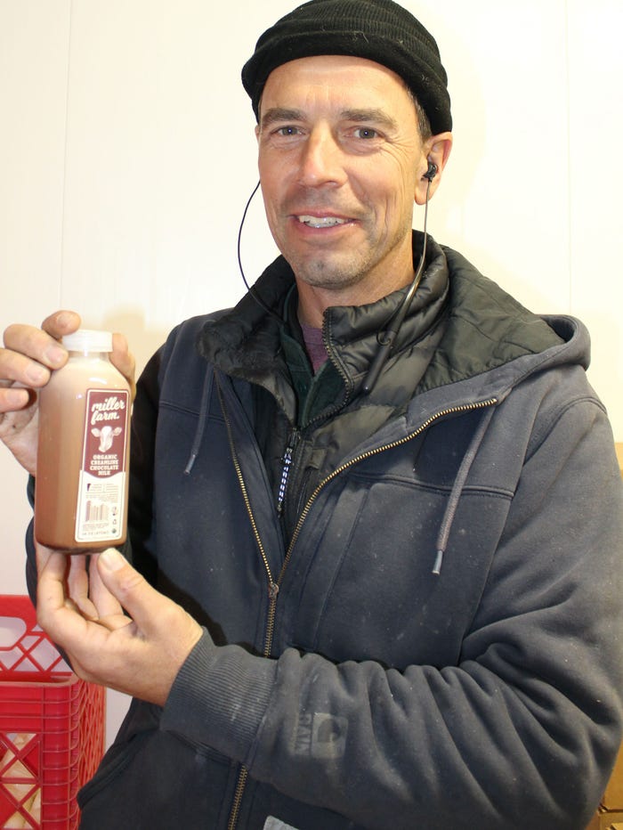 Susan Harlow - Peter Miller smiles and holds a bottle of chocolate milk