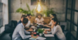 lightbulb hanging above meeting table