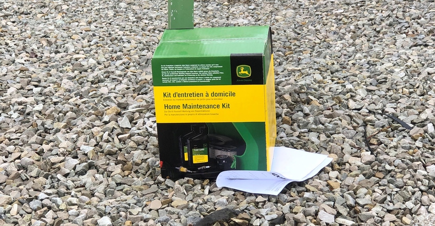 John Deere boxed home maintenance kit sitting on curb