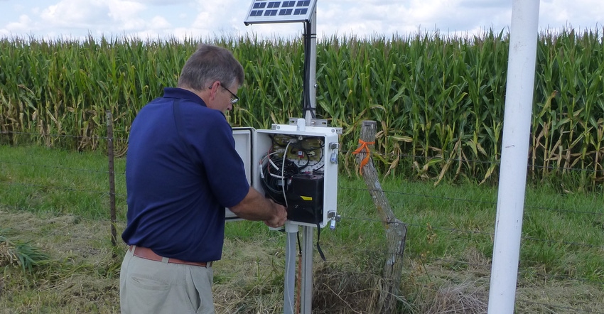 man looking at hydrologic station man looking at hydrologic station