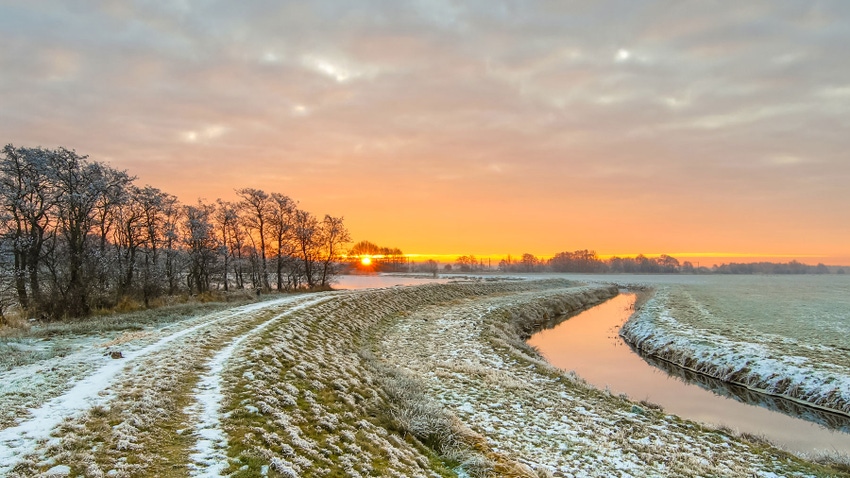 meandering river in frozen grassland