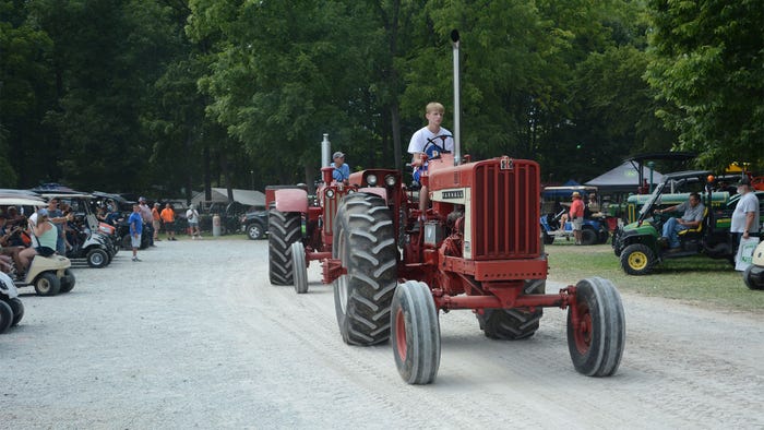 A parade of vintage Farmall tractors A parade of vintage Farmall tractors