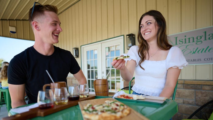 Man and woman at outdoor winery bar Man and woman at outdoor winery bar