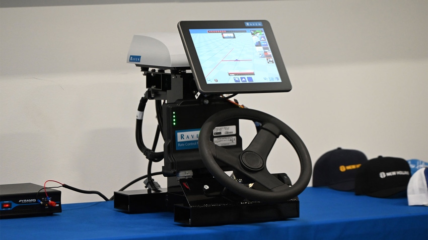 A driving simulator set up with a screen and steering wheel