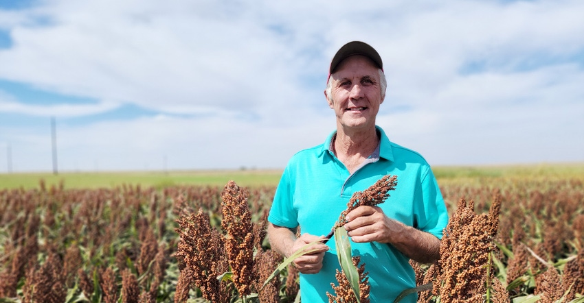 swfp-shelley-huguley-kody-carson-holding-sorghum-banner.jpg