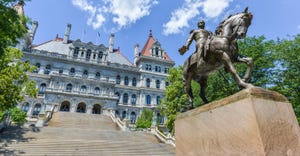 The New York State Capitol Building in Albany with monument of General Sherman on horseback