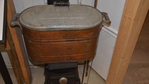 An early 20th century laundry stove and copper boiler
