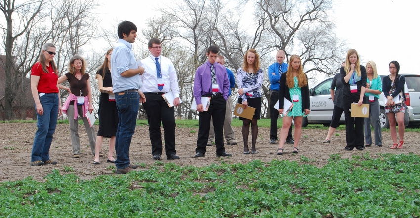High school students listen to a presentation outdoors at the The World Food Prize Youth Institute at Iowa State University 