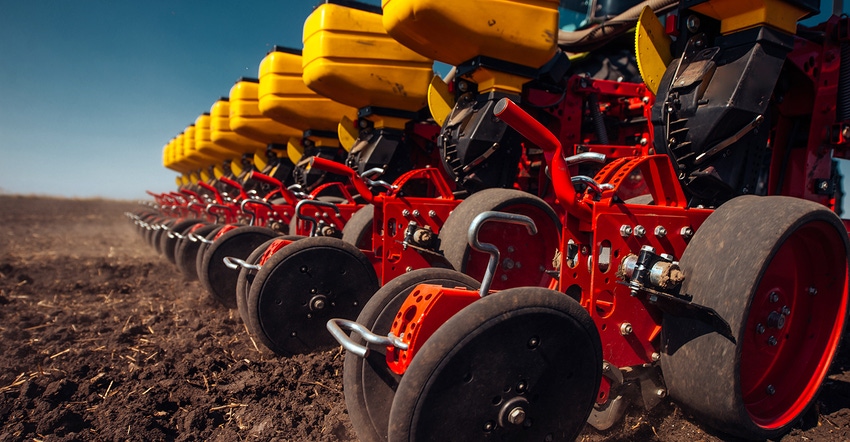 crop planter in field up close