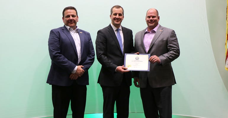 Officials of Fareway Stores, headquartered in Boone, received the award for leadership in agricultural advocacy, presented by Iowa Ag Secretary Mike Naig (center).