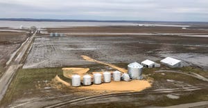 Flooded field, damaged grain bins