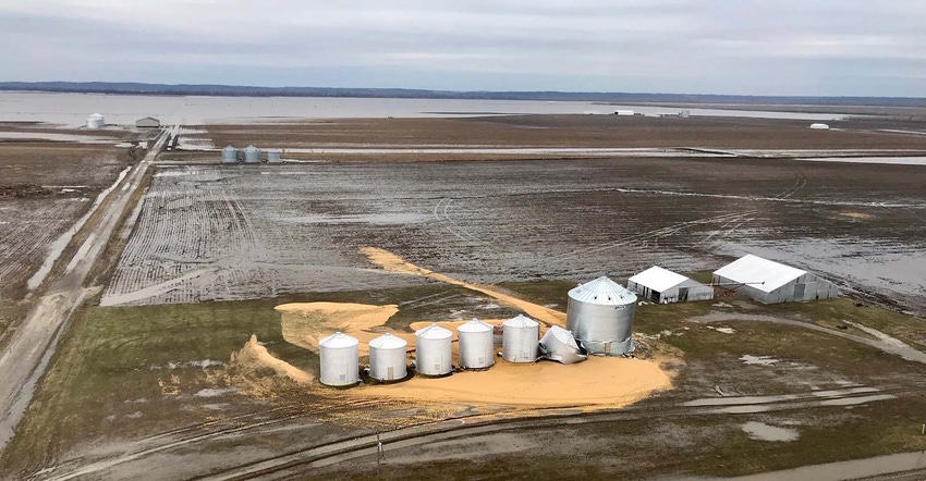 Flooded field, damaged grain bins Flooded field, damaged grain bins