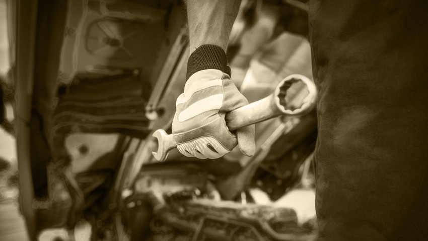 Mechanic with large wrench in hand Mechanic with large wrench in hand