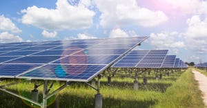 solar farm against blue sky