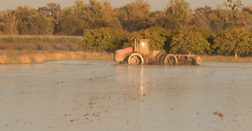 tractor in flooded field