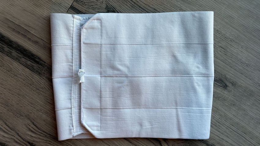 A white, cloth abdominal wrap