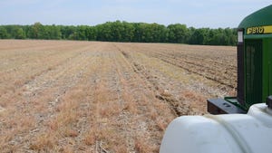 View from tractor cab of a field ready for planting