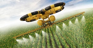 Flying utility drone spraying pesticide over a corn field