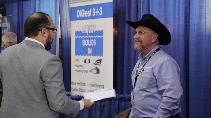 two men at a trade show two men at a trade show
