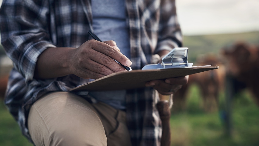 Farmer with clipboard