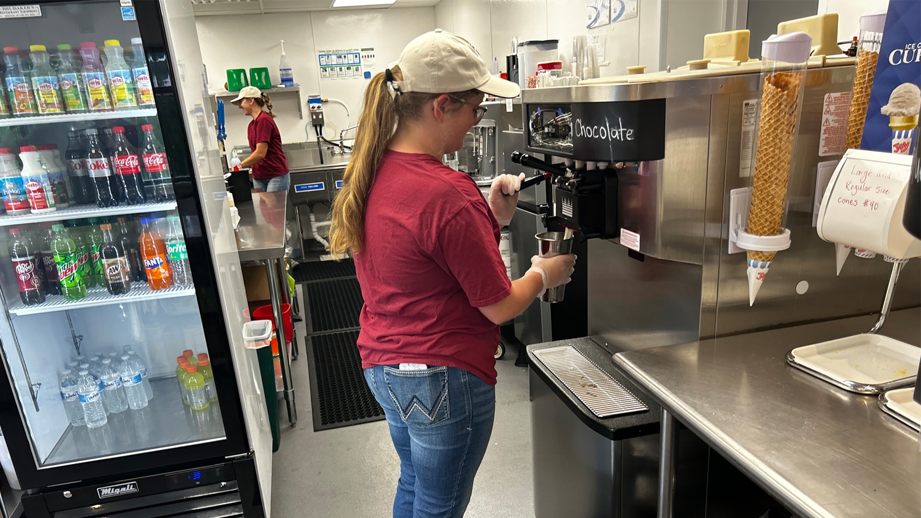 Chris Torres - An employee prepares an ice cream treat at Colebrook Crossing restaurant