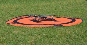 drone on mat in grass