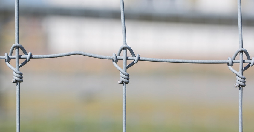 closeup of wire fencing joints