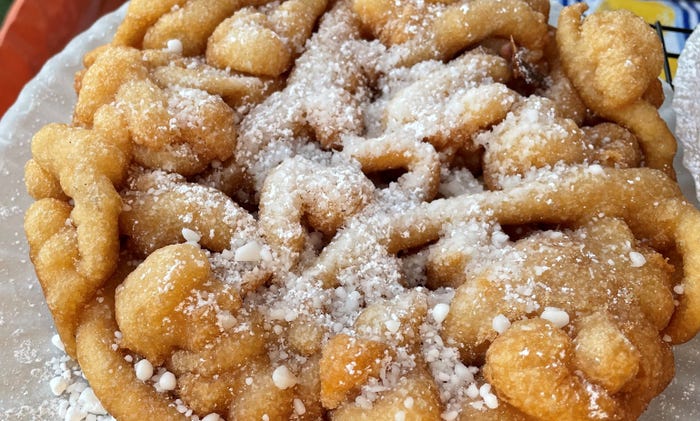 funnel cake covered in powdered sugar