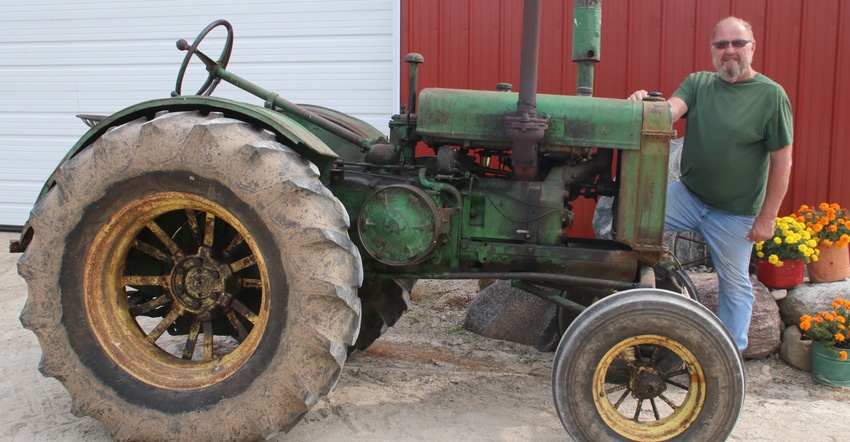 Junior Priesgen of Rubicon, Wis., with his 1931 GP John Deere tractor 