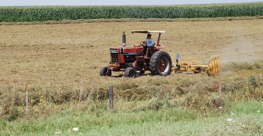 young man on tractor in field