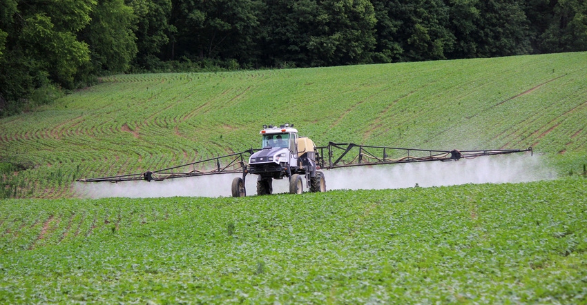 A sprayer on a soybean field A sprayer on a soybean field