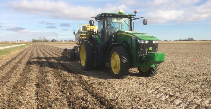 tractor planting in field