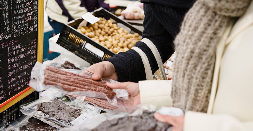 Couple with dried meat at farmer's market Couple with dried meat at farmer's market