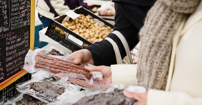 Couple with dried meat at farmer's market