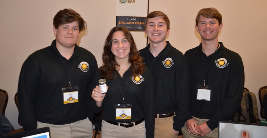 Rob Bastian, Sarah Juffer, Charlie Seabright and Josh Stephenson display the soy ink for dry erase boards they developed. 
