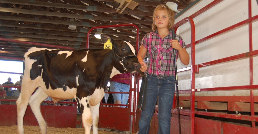 Young girl shows her calf